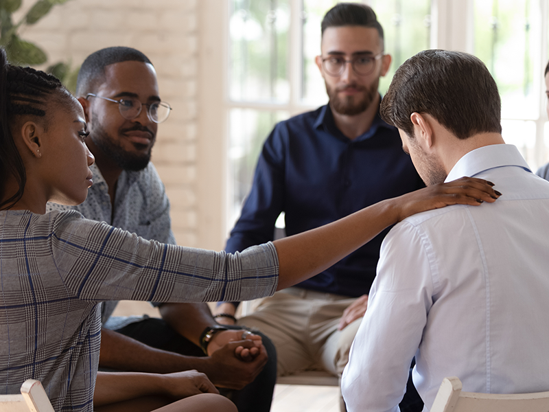 Group providing support during an Alcohol Addiction Treatment session