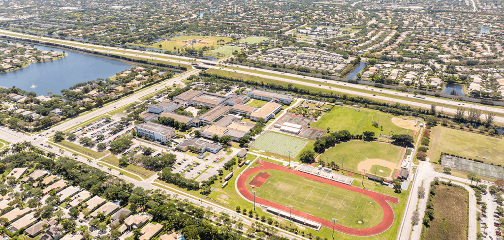 Aerial view of Parkland, Florida, showing neighborhoods, highways, and sports fields.